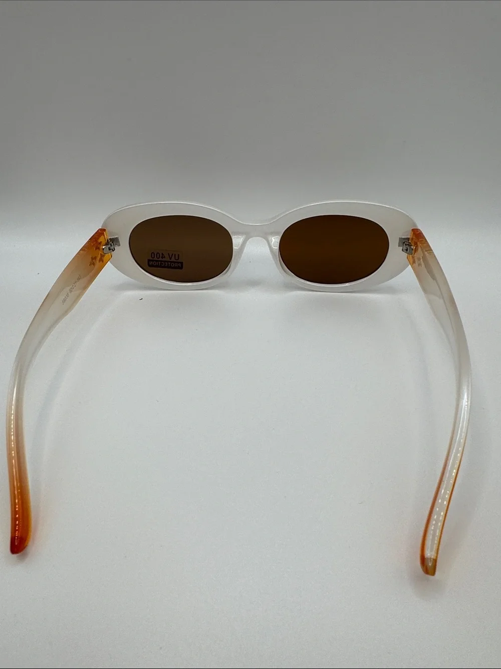 White Oval Sunglasses with Brown Lenses